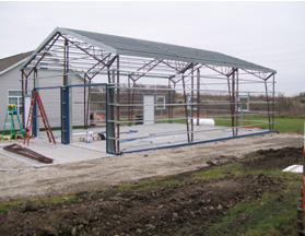 The frame of a clearance metal building kit from Worldwide Steel Metal