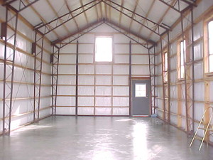 The empty interior of a metal building designed and built by Worldwide Steel Buildings