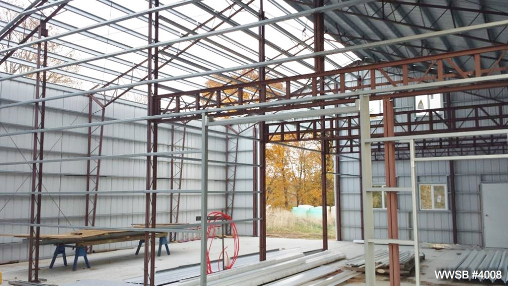 Progress photo of metal garage in construction.
