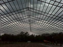 The roof of a steel horse arena that was built by Worldwide Steel Buildings.
