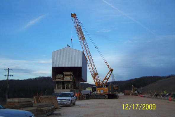A steel building being delivered via crane by Worldwide Steel Buildings to a client in Missouri.