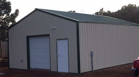 An outdoor, steel workshop designed and built by Worldwide Steel Buildings for a client in Colorado.