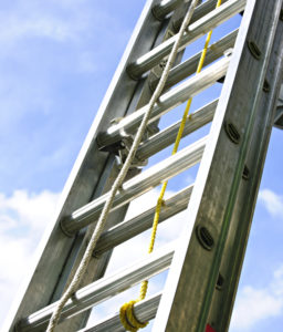 An extension ladder being used outdoors