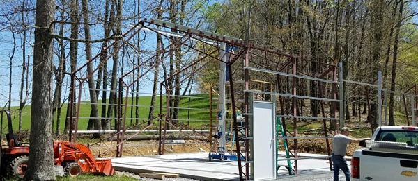 The steel structure of a new outdoor garage built by Worldwide Steel Buildings.