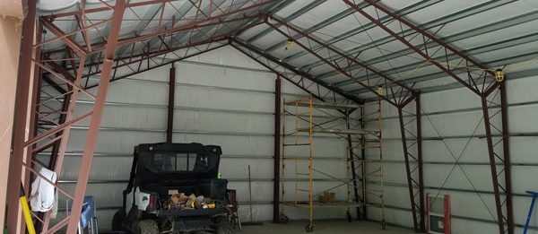 An interior shot of the completed outdoor, steel garage designed and built by Worldwide Steel Buildings.