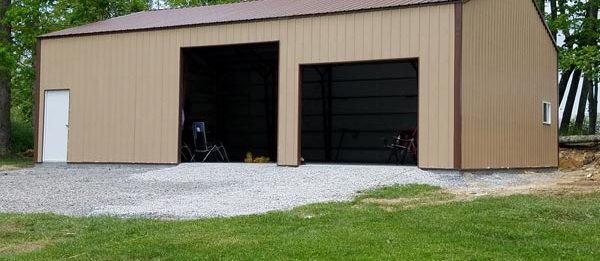 An exterior shot of the completed outdoor, steel garage designed and built by Worldwide Steel Buildings.