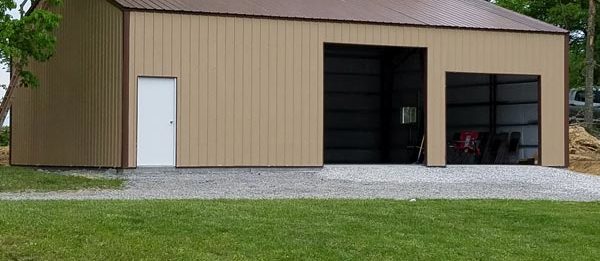 An exterior shot of the completed outdoor, steel garage designed and built by Worldwide Steel Buildings.