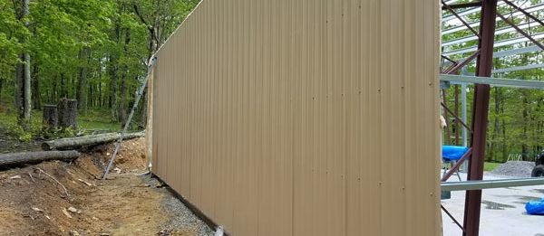  One of the painted walls fully installed for a new outdoor garage built by Worldwide Steel Buildings.