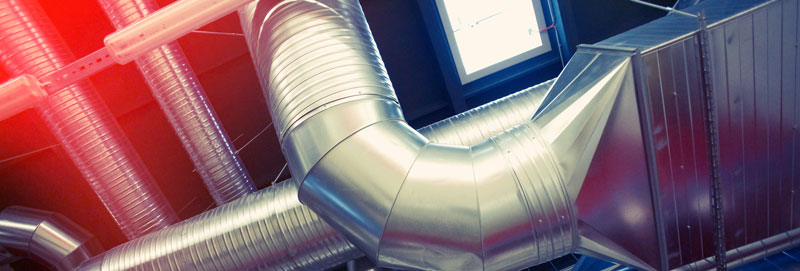 Ducts of an HVAC system inside of a metal building

