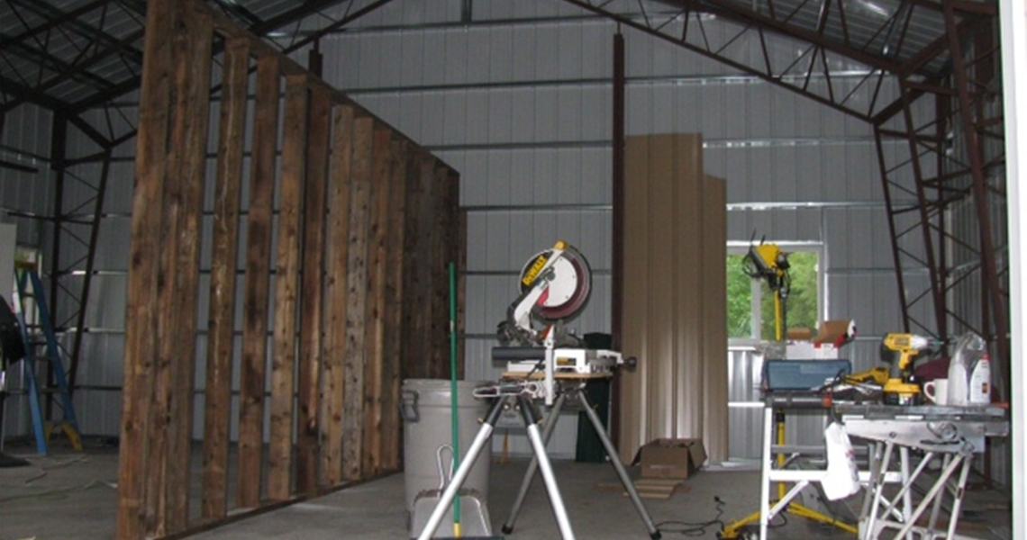 The interior of a custom metal garage with overhang built by Worldwide Steel Buildings.