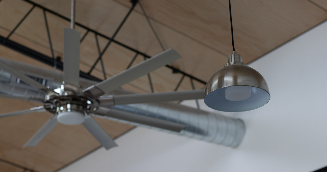 A ceiling fan and a hanging light fixture