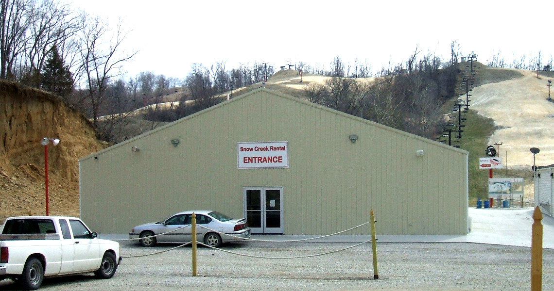A beige building with a sign reading 