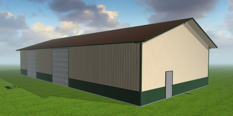 A simple, large Ag Barn with beige and green siding and a dark brown roof stands on a grassy field under a partly cloudy sky. The barn features two large sliding doors on the side and a single door on the end.