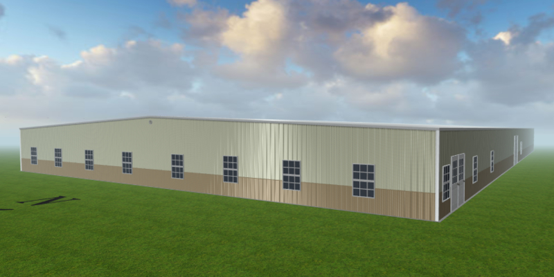 Nemo Mfg's large warehouse, with its beige and brown exterior and multiple windows, stands proudly in a green grass field. Under a partly cloudy sky, it is a testament to modern manufacturing within the industry.