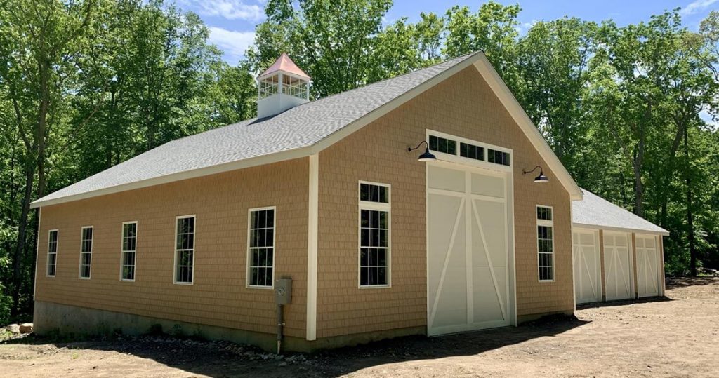 Exterior of tan garage building.
