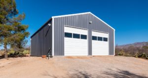 A gray, outdoor, steel workshop built in Vail, AZ by Worldwide Steel Buildings.