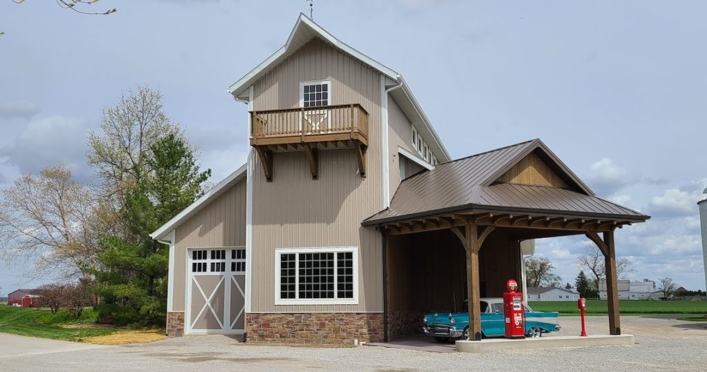 Two Story Barndominium Project with cool old blue car in front