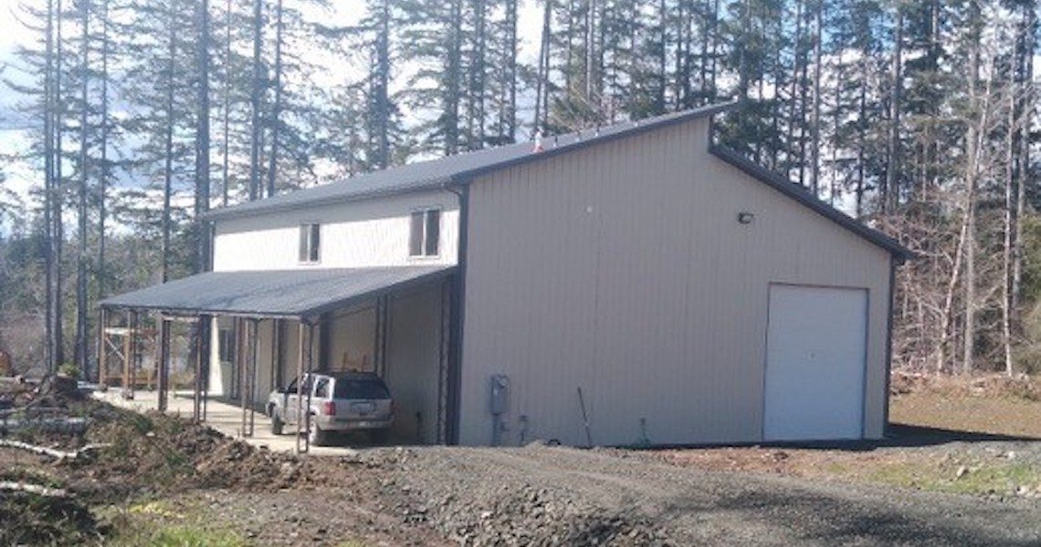 A steel, outdoor workshop built in Olympia, WA by Worldwide Steel Buildings.