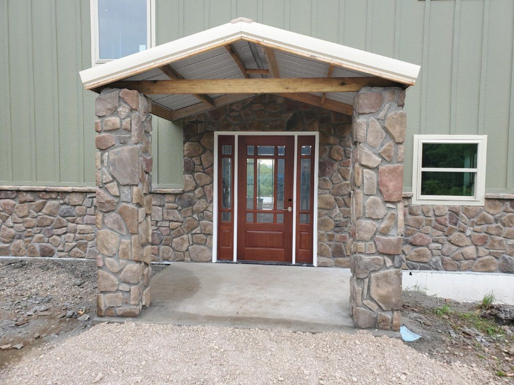 Front door of metal building home.