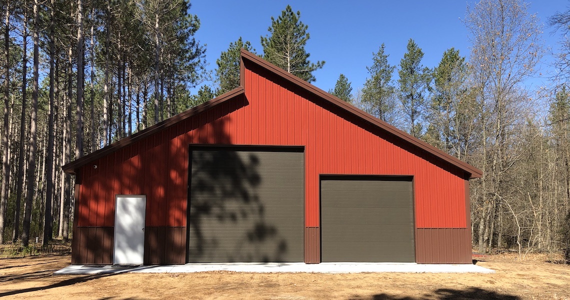 A red steel garage built in Pleasant Prairie, WI by Worldwide Steel Buildings.