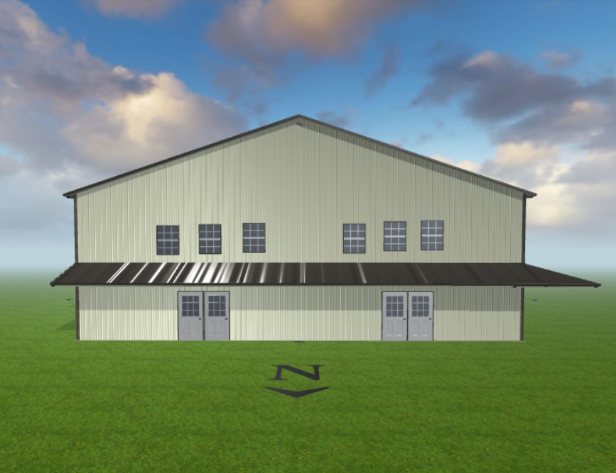 Front view of a large beige metal barn with two double doors and a dark roof, set on a lush green lawn under a partly cloudy sky. A directional arrow marked 'N' is on the ground in front of the barn.