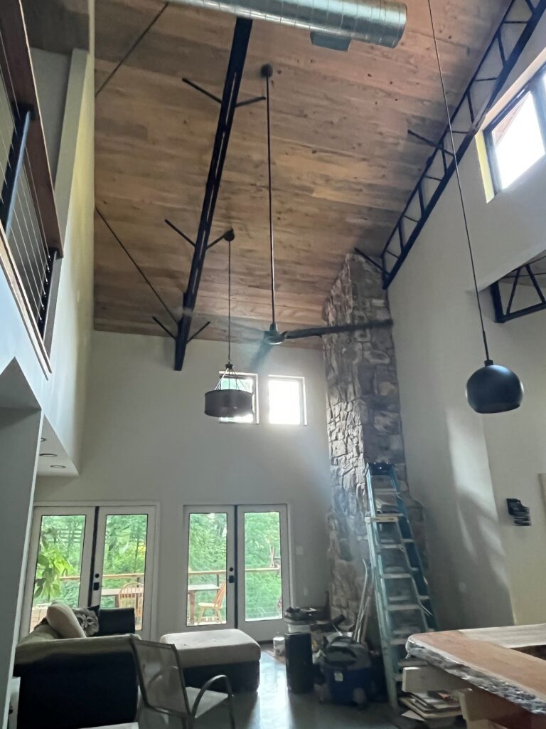 Interior with High Ceilings and Exposed Trusses/Duct Work