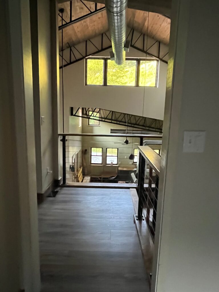 Interior with High Ceilings and Exposed Trusses/Duct Work