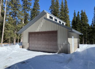 Steel Garage in Snowy Woods