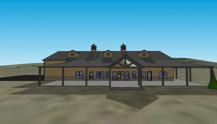 A 3D rendering of a large, single-story barndominium with a gray roof, multiple windows, and a covered entrance. The structure features two cupolas on the roof and a sienna wooden exterior with a spacious porch, set against a clear blue sky.