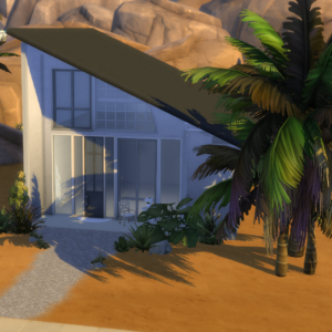 A modern, angular house with large glass windows stands in a desert setting. Palm trees and sparse desert plants surround The Kupp: 30x30 Tiny Home Kit. The sun casts shadows of the trees on the sandy ground, blending nature with innovative design.