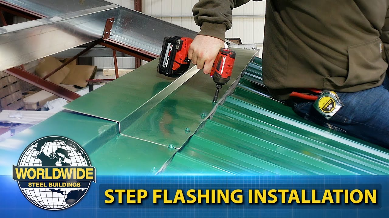 A person using a red power drill expertly installs step flashing on a green metal roof in a bustling workshop, showcasing the ease of metal building installation. Text reads "Worldwide Steel Buildings: Step Flashing Installation.