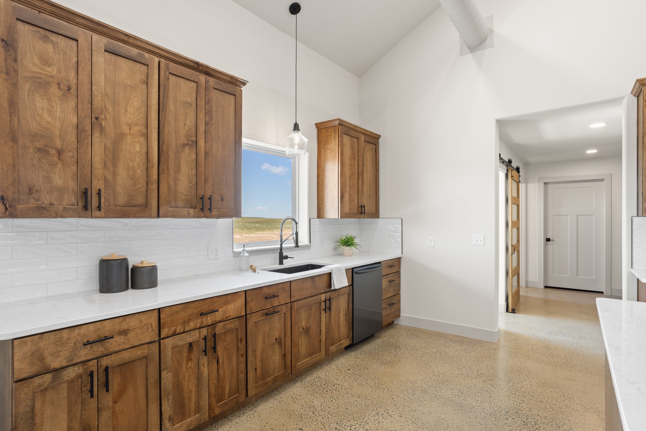 Kitchen cabinetry and countertop next to the mudroom interior-barndominium-cheyenne-wyoming