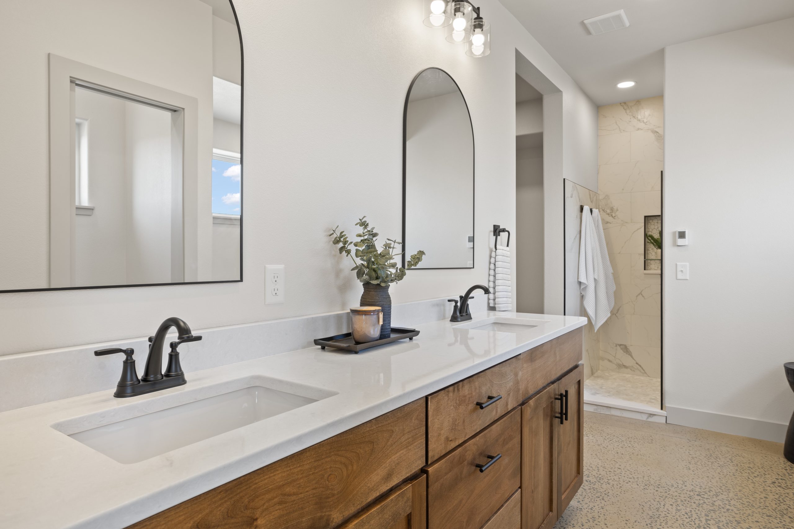 Bathroom with a sink and shower inside a barndominium in Cheyenne, Wyoming