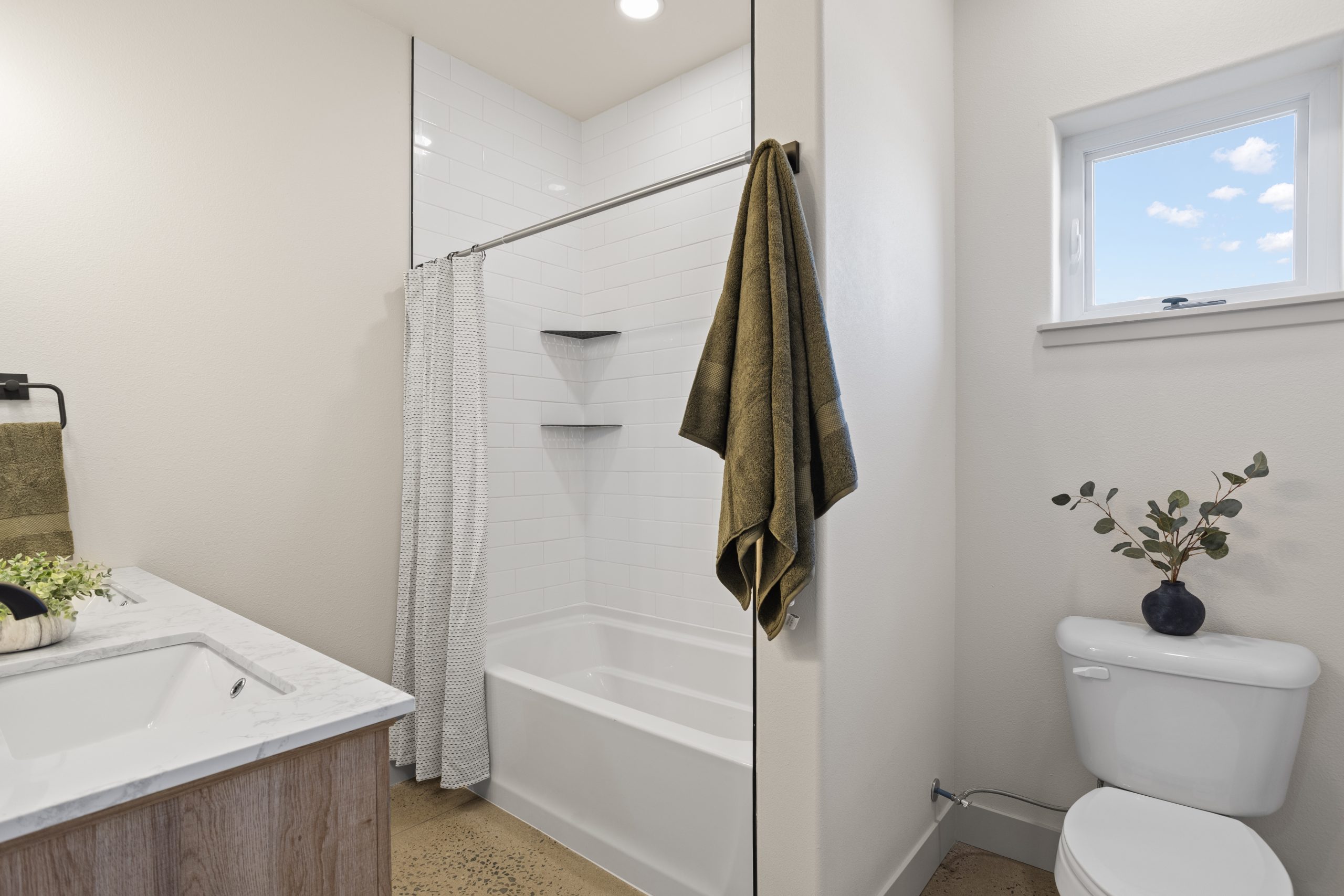 Bathroom with bathtub and vanity top inside a barndominium in Cheyenne, Wyoming