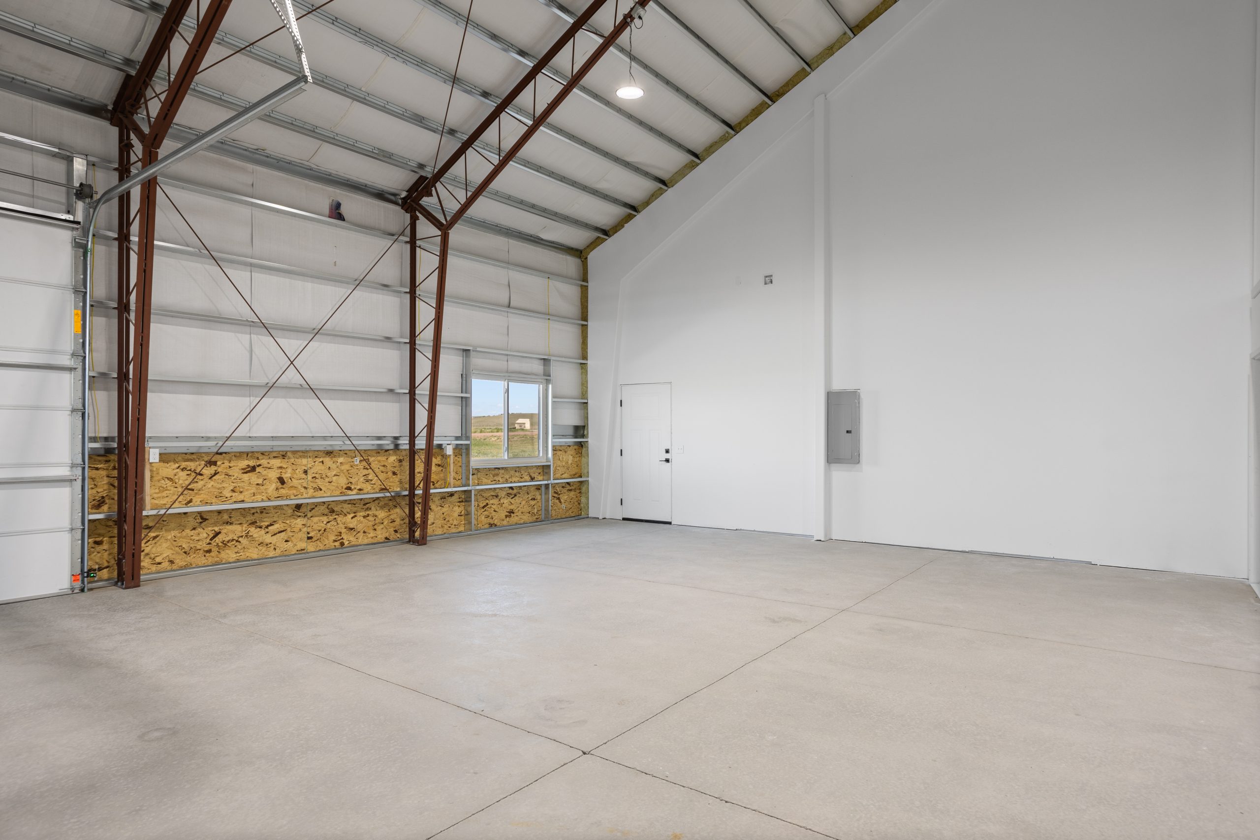 White garage interior of a 60x34 barndominium in Cheyenne, Wyoming